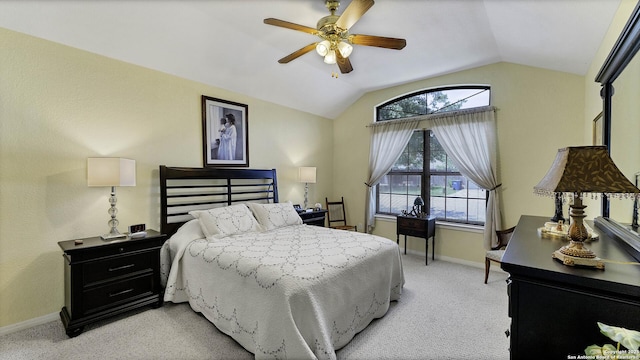 carpeted bedroom with ceiling fan and lofted ceiling