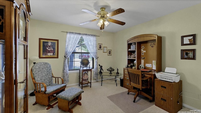 office space featuring ceiling fan and light colored carpet