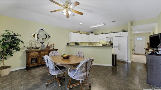 dining room featuring ceiling fan