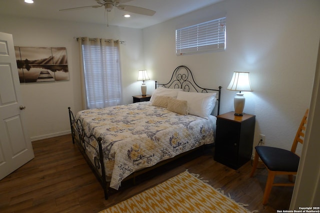 bedroom featuring ceiling fan and dark wood-type flooring