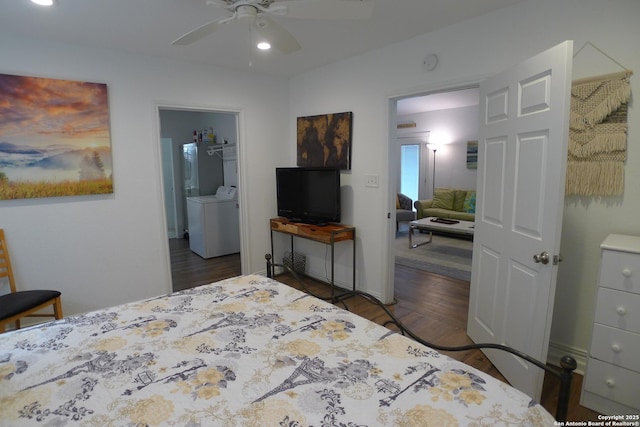 bedroom with ceiling fan, ensuite bathroom, dark hardwood / wood-style flooring, and washing machine and dryer