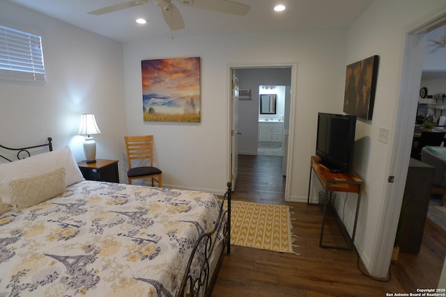 bedroom with ceiling fan, ensuite bathroom, and dark hardwood / wood-style floors