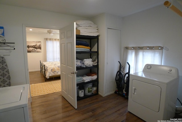 laundry area featuring ceiling fan, dark hardwood / wood-style floors, and separate washer and dryer