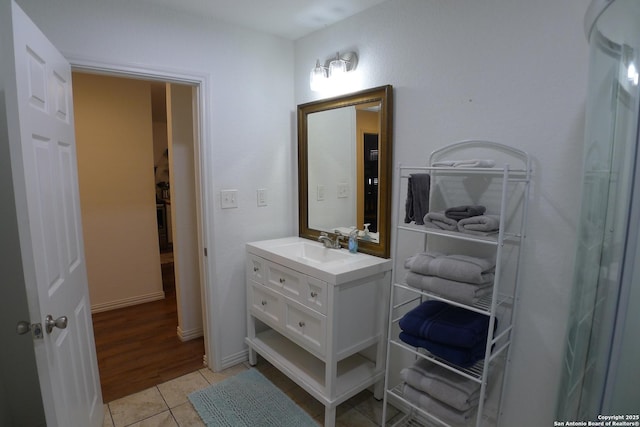 bathroom featuring tile patterned flooring and vanity