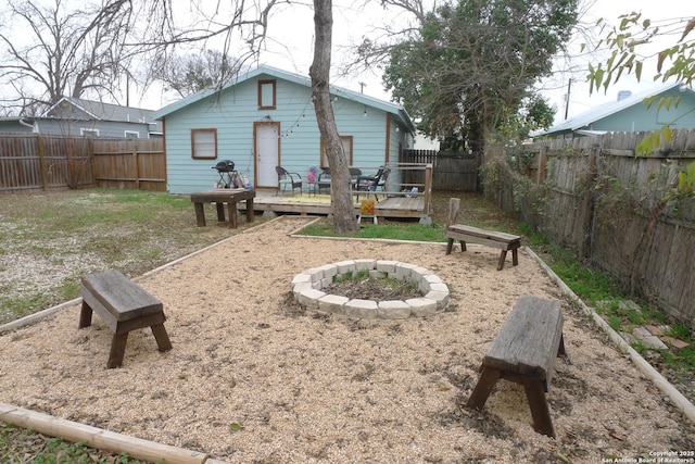 back of property with a wooden deck