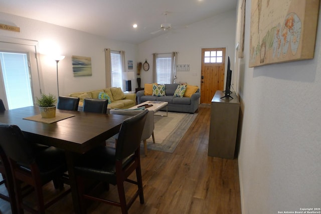 dining room featuring ceiling fan, dark hardwood / wood-style floors, and lofted ceiling