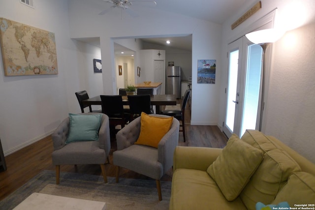 living room featuring ceiling fan, dark hardwood / wood-style floors, lofted ceiling, and french doors