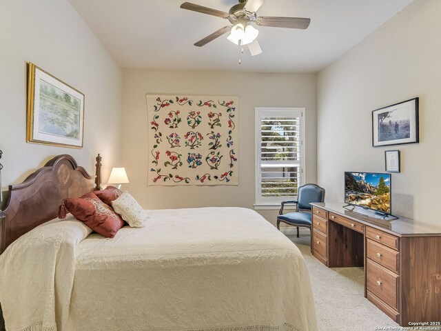 bedroom featuring ceiling fan and light colored carpet