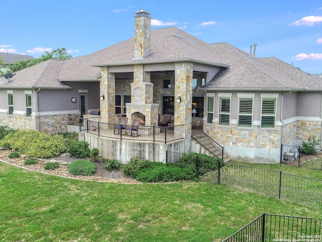 rear view of house featuring a lawn and a stone fireplace