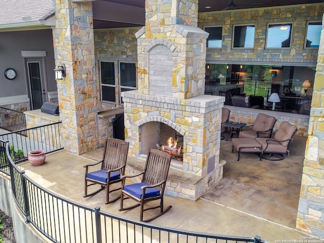 view of patio / terrace with an outdoor stone fireplace