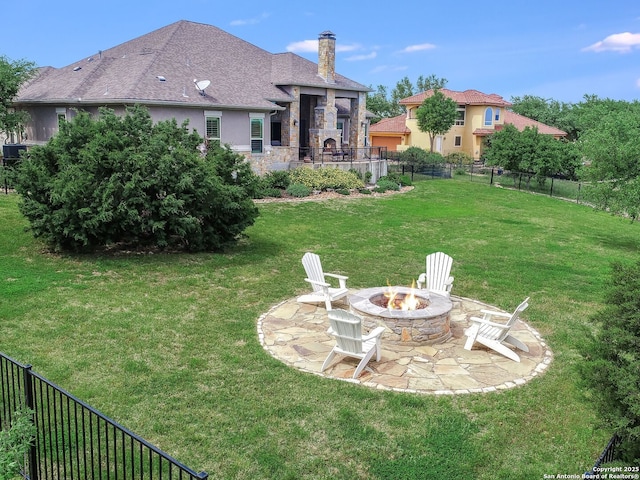 view of yard featuring a patio area and a fire pit