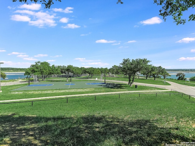 view of community featuring a yard and a water view