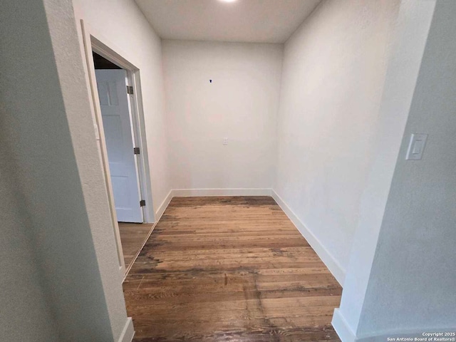 hallway featuring wood-type flooring