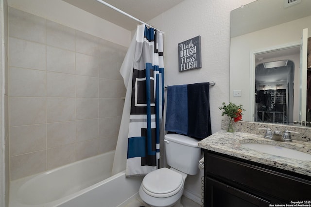 full bathroom featuring shower / bath combination with curtain, vanity, and toilet