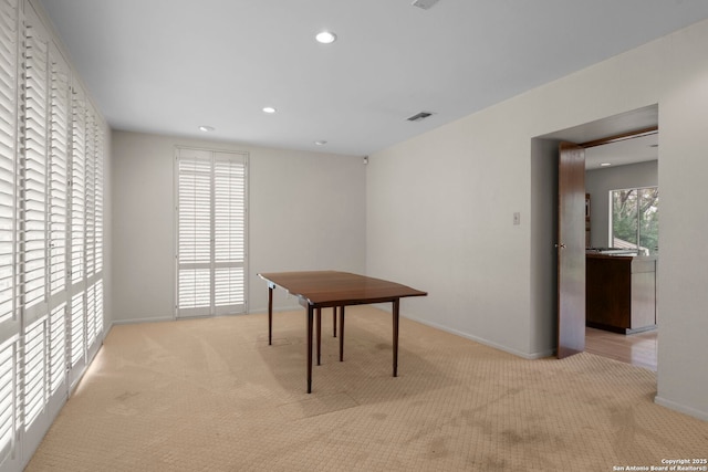 view of carpeted dining space