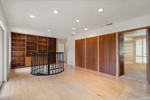 spare room with light hardwood / wood-style flooring