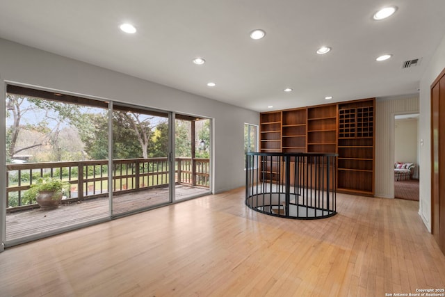 spare room with light hardwood / wood-style floors