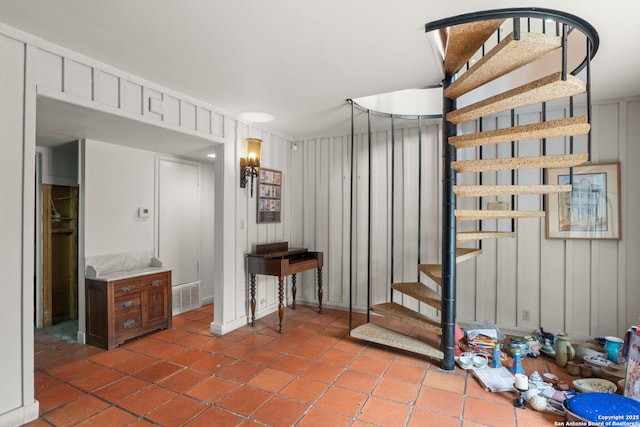 staircase with tile patterned flooring