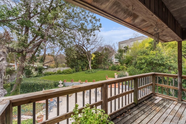 wooden deck with a yard