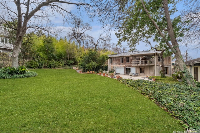 view of yard with a deck and a patio area