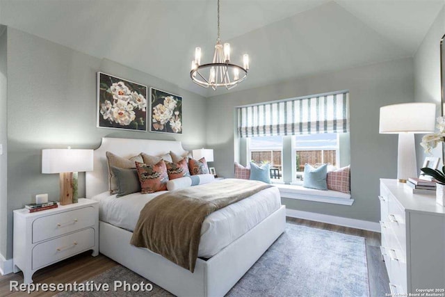 bedroom featuring vaulted ceiling, a chandelier, and dark hardwood / wood-style floors