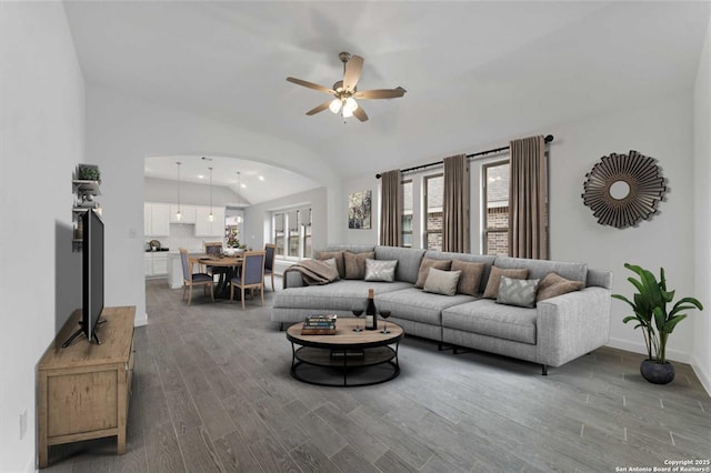 living room featuring lofted ceiling, ceiling fan, and hardwood / wood-style floors