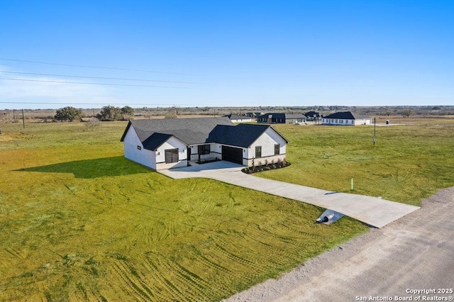 birds eye view of property featuring a rural view