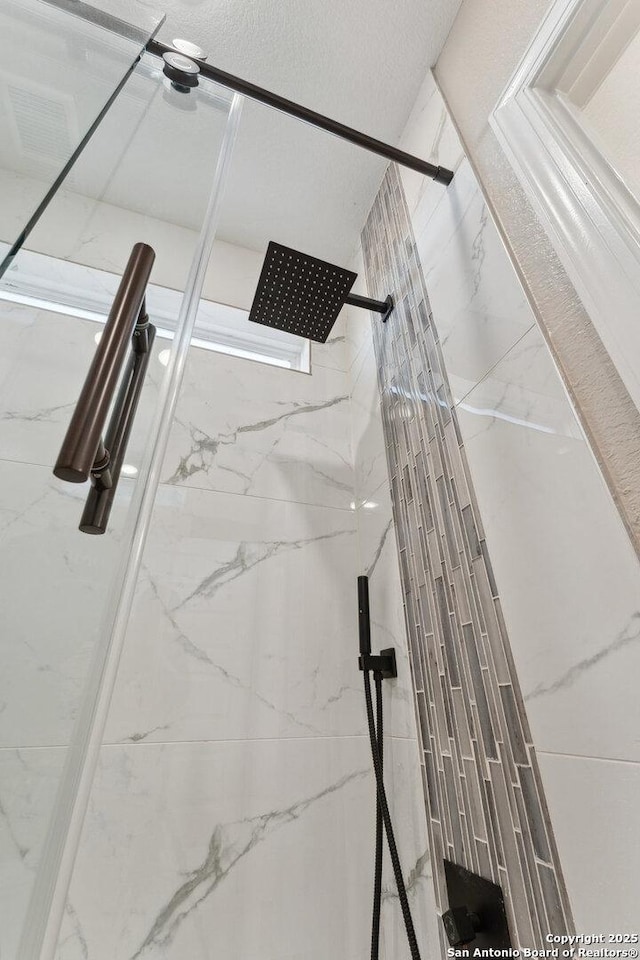 details with a tile shower