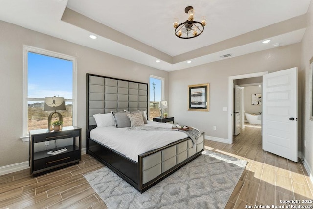 bedroom with a raised ceiling