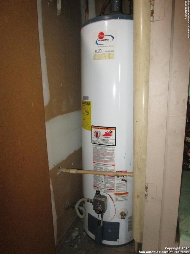 utility room with gas water heater