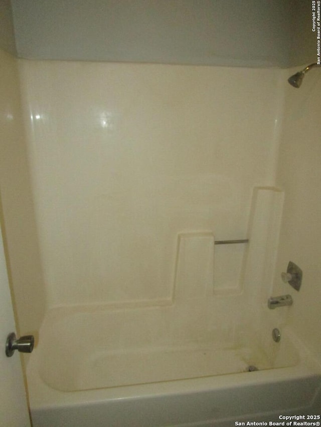 bathroom with shower / bath combination