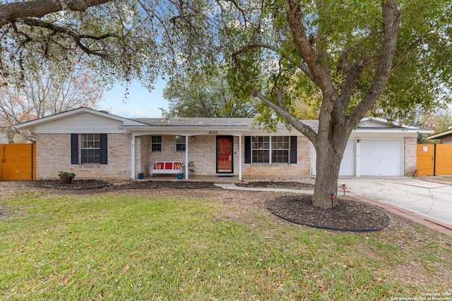 ranch-style house with a front lawn and a garage