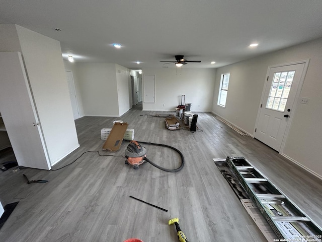 interior space with ceiling fan and hardwood / wood-style flooring