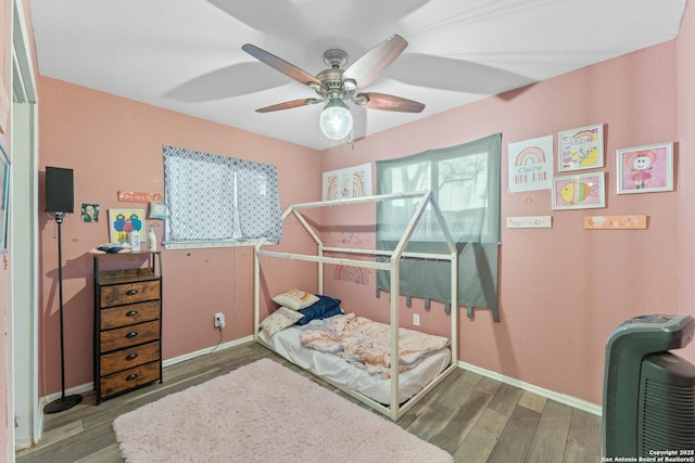 bedroom featuring ceiling fan and wood-type flooring