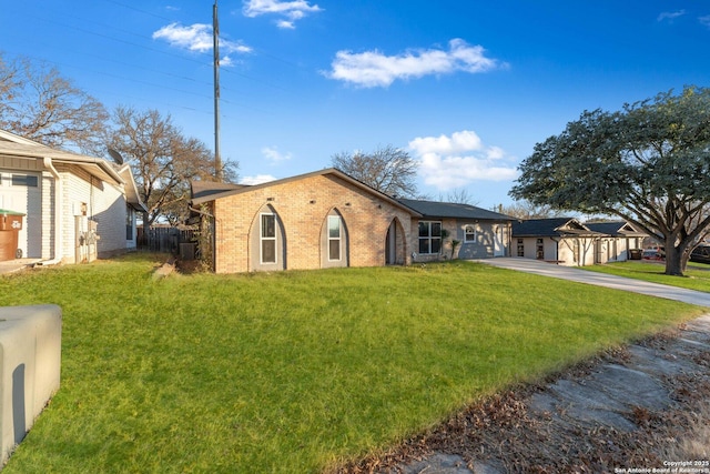 ranch-style house with a front lawn