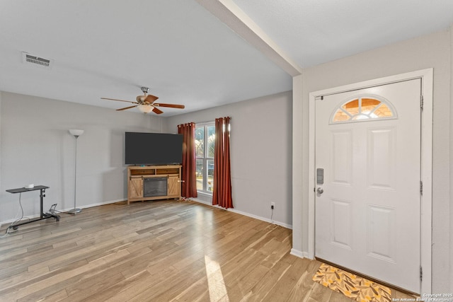 foyer featuring ceiling fan and light hardwood / wood-style floors