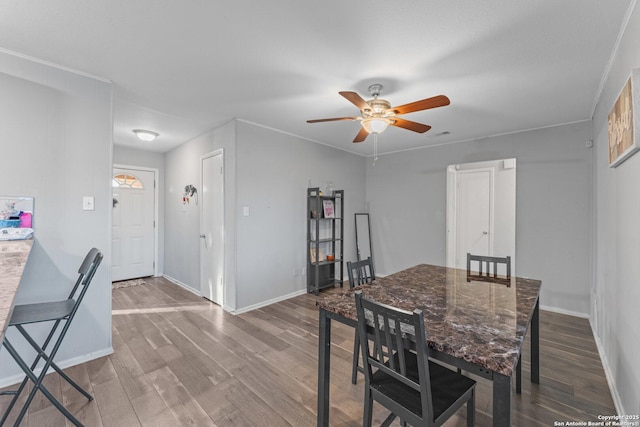 dining area featuring hardwood / wood-style flooring and ceiling fan