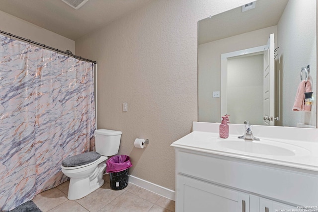 bathroom with toilet, vanity, tile patterned flooring, and curtained shower