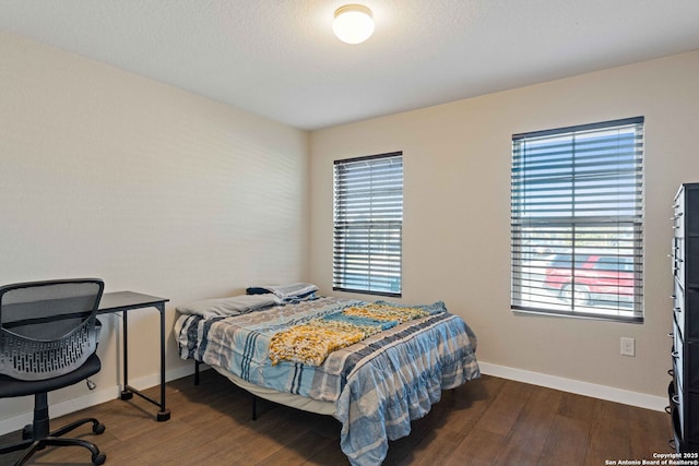 bedroom featuring dark wood-type flooring