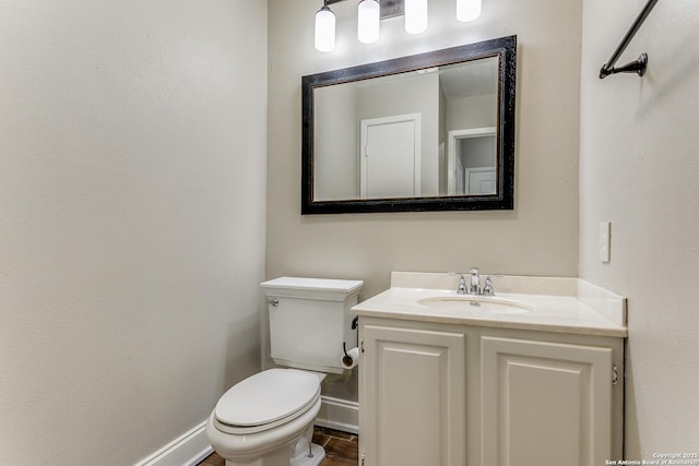 bathroom with toilet and vanity