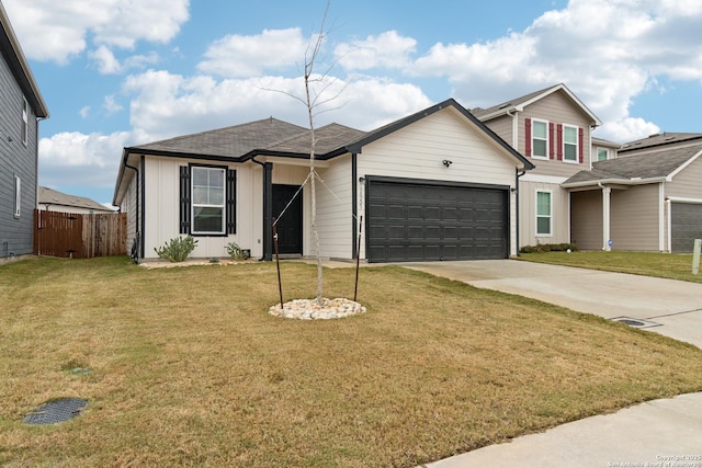 view of front facade with a garage and a front lawn