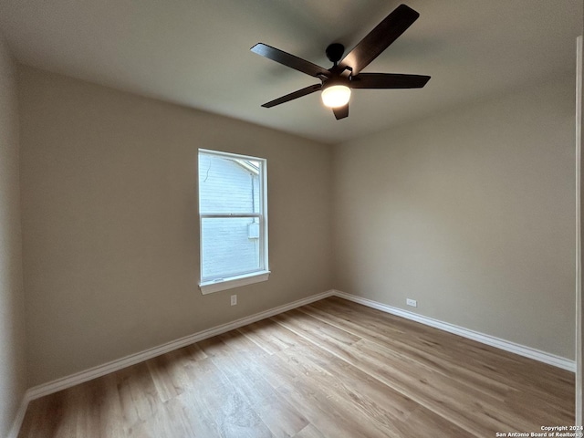 unfurnished room featuring light hardwood / wood-style floors and ceiling fan