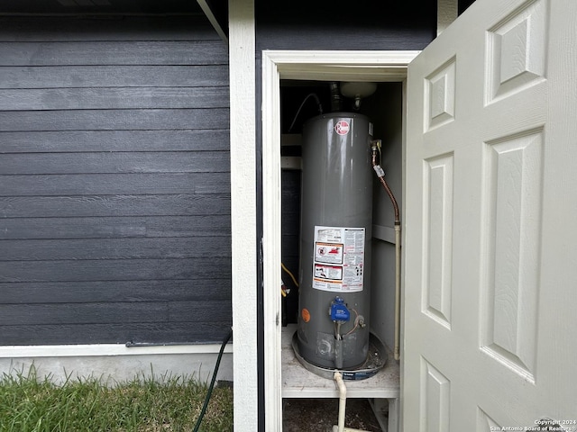 utility room with water heater