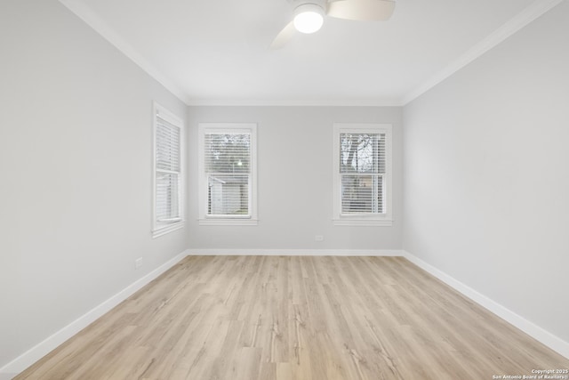 empty room featuring ornamental molding, ceiling fan, and light wood-type flooring