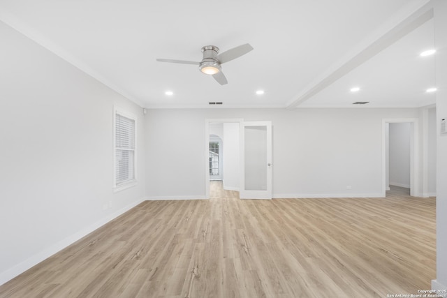 spare room with ceiling fan, crown molding, and light hardwood / wood-style floors