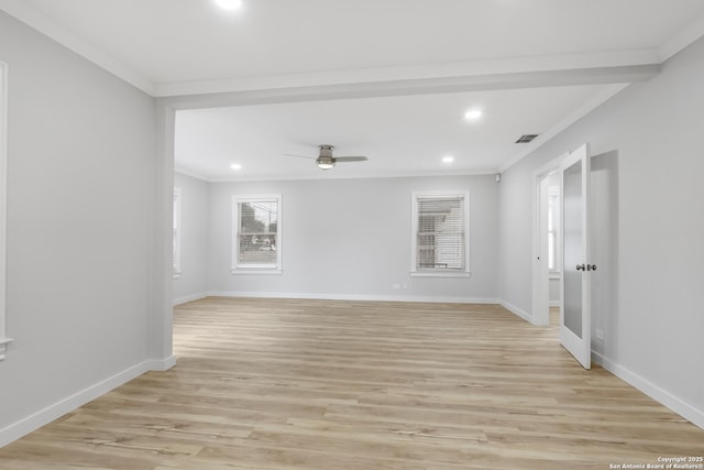 empty room featuring ornamental molding, light wood-type flooring, and ceiling fan