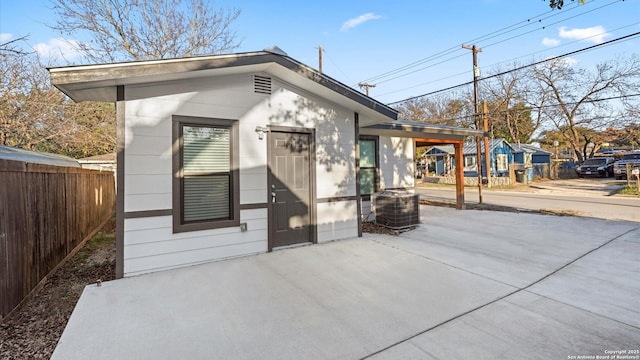 exterior space featuring a patio and central AC