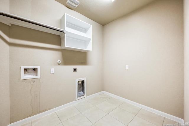 washroom featuring electric dryer hookup, light tile patterned floors, hookup for a gas dryer, and washer hookup