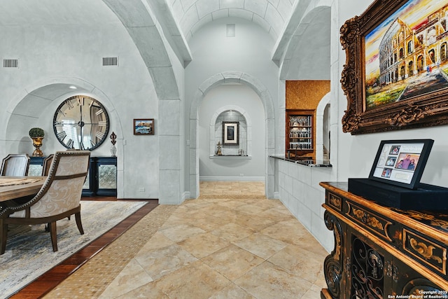 interior space with a towering ceiling