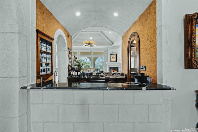 bar featuring brick ceiling and lofted ceiling